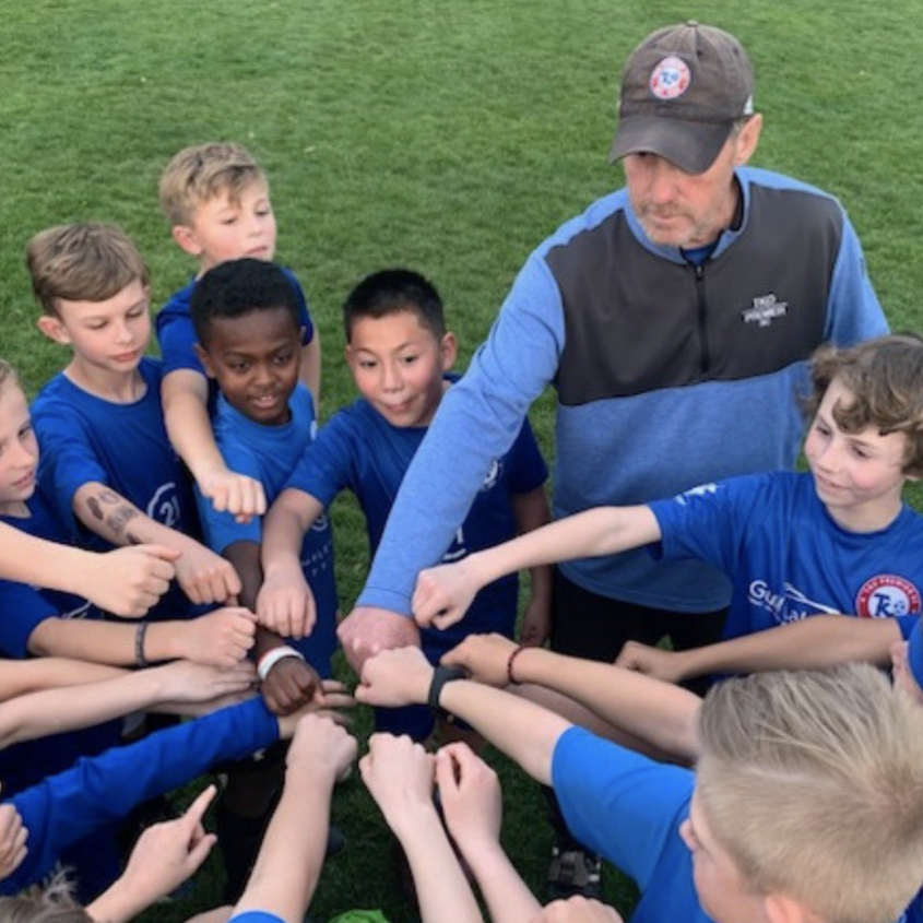 TKO camp Neil high five